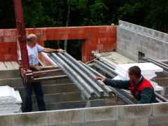 The floor beams are precast prestressed inverted 'T' concrete.  they started with the floor over the cellar.